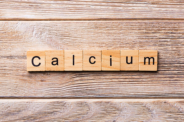 calcium-word-written-on-wood-block-calcium-text-on-wooden-table-for-your-desing-concept